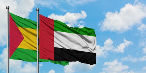 Sao Tome And Principe and United Arab Emirates flag waving in the wind against white cloudy blue sky together. Diplomacy concept, international relations.