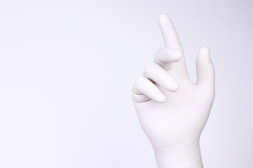 White hand. Hand with white glove on light background.