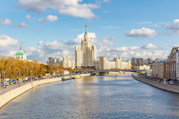 View of Moskva River against famous stalin skyscraper on Kotelnicheskaya Embankment in Moscow downtown at sunny autumn day. Moscow in autumn