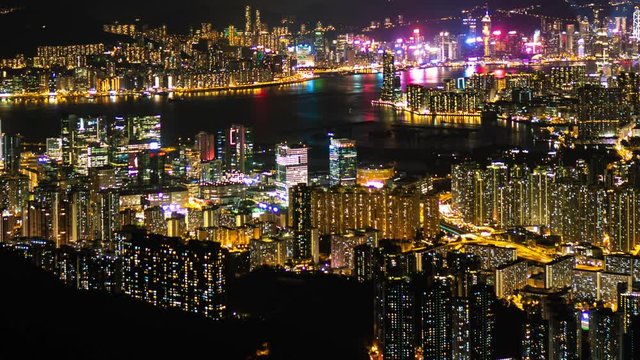 Hong Kong cityscape of Victoria Harbour in Hong Kong time-lapse day to night at West Kowloon, Hong Kong, China