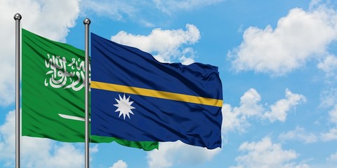 Saudi Arabia and Nauru flag waving in the wind against white cloudy blue sky together. Diplomacy concept, international relations.