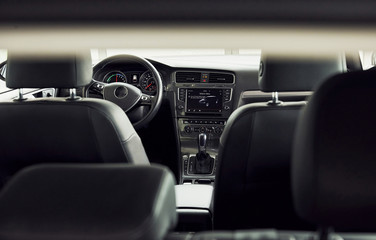 Naklejka premium Inside of brand new modern electrical car. Particle view. Cropped photo