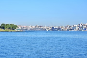 Fototapeta premium Istanbul Bosphorus sea view with ship and historical buildings on background . View of the sea and the old city of Istanbul from the ferry from Karakoi.