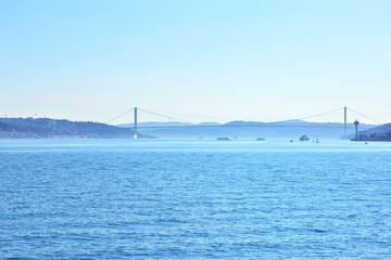 Obraz premium Istanbul Bosphorus sea view with ship and historical buildings on background . View of the sea and the old city of Istanbul from the ferry from Karakoi.