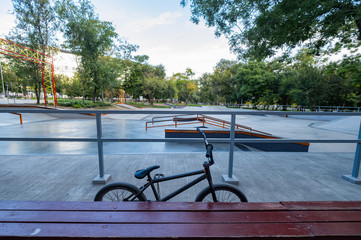 BMX bicycle stand in empty skatepark - obrazy, fototapety, plakaty
