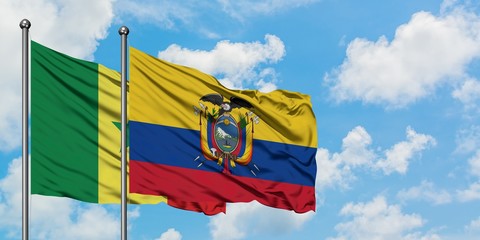 Senegal and Ecuador flag waving in the wind against white cloudy blue sky together. Diplomacy concept, international relations.