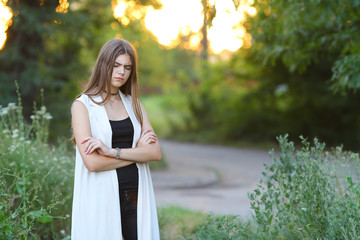 young girl on nature shows emotions