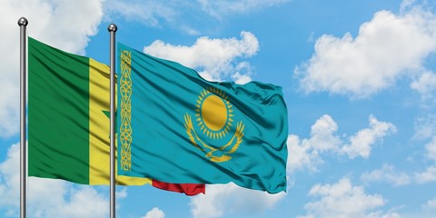 Senegal and Kazakhstan flag waving in the wind against white cloudy blue sky together. Diplomacy concept, international relations.