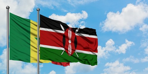 Senegal and Kenya flag waving in the wind against white cloudy blue sky together. Diplomacy concept, international relations.