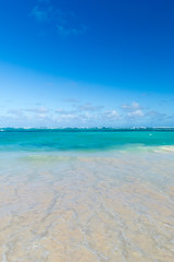 Fototapeta premium Sea wave on the sand of a tropical beach in a wild turquoise bay