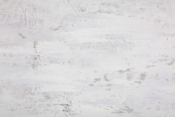 Textural white background with a transition to gray. View from above. Uneven surface. . Background for designers.