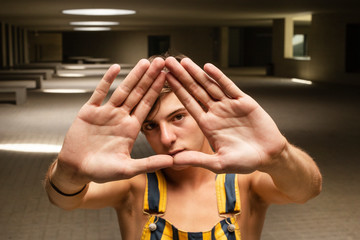 eyes young man and triangle hands