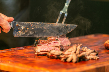 Close up hands of chef preparing food in the kitchen of a restaurant, cooking concept