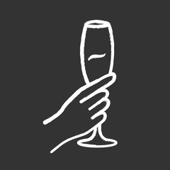 Hand holding glass of wine chalk icon. Champagne stemware. Glassful of alcohol beverage. Wine service. Celebration. Wedding. Tasting, degustation. Cheers. Isolated vector chalkboard illustration