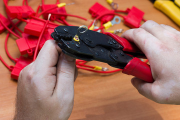 the process of crimping automotive terminals with a man