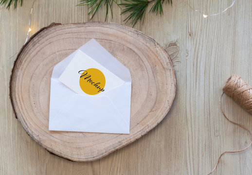 White Horizontal Business Card with Envelope on Wood Mockup