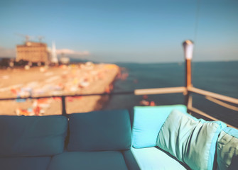 Restaurant on the pier. Sunny day by the sea. Seaside resort. Beautiful sea view. Blur effect