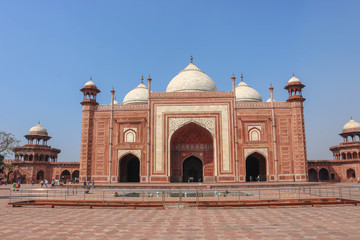 Fototapeta na wymiar AGRA, UP, INDIA - MARCH 7, 2019: The grand Taj Mahal mosque, or Masjid, in Agra. It is on the western side of the Taj Mahal. The mosque at the Taj Mahal stands on a sandstone platform.
