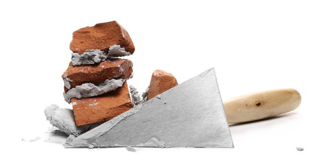 Cement mortar and metal trowel isolated on white background