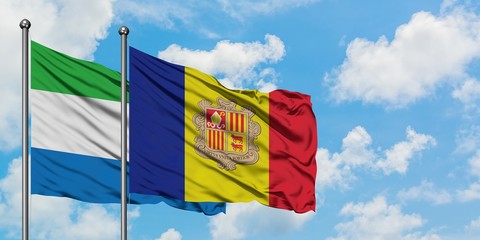Sierra Leone and Andorra flag waving in the wind against white cloudy blue sky together. Diplomacy concept, international relations.