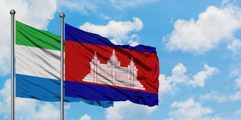 Sierra Leone and Cambodia flag waving in the wind against white cloudy blue sky together. Diplomacy concept, international relations.