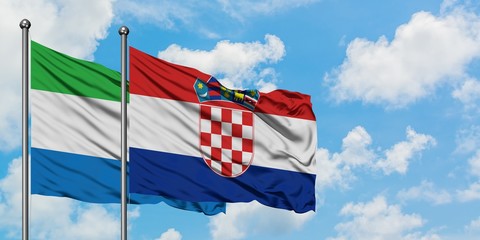 Sierra Leone and Croatia flag waving in the wind against white cloudy blue sky together. Diplomacy concept, international relations.