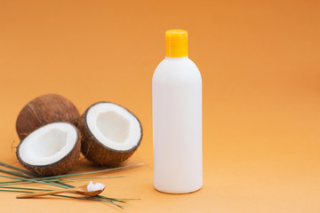 shampoo for healthy hair from eco products on a beige background with coconut oil