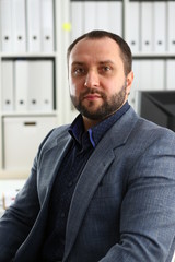 Fototapeta premium portrait of young handsome promising businessman in office
