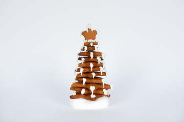 The hand-made eatable gingerbread New Year tree in snow decoration
