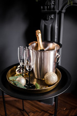 Holiday set. Champagne in a cooling bucket with glasses for couples in love.