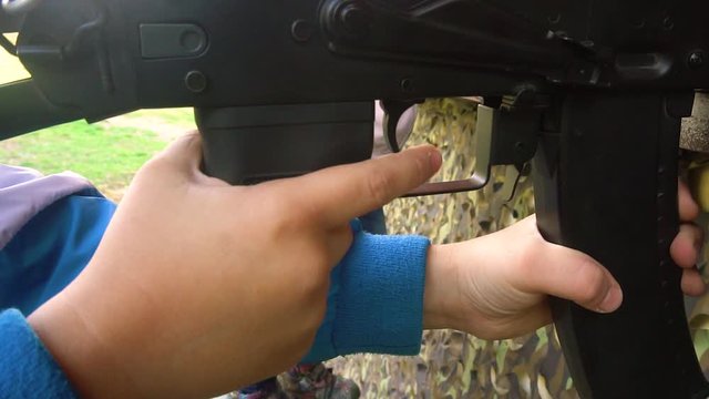 The child shoots dash with weapons. finger pulls the trigger.