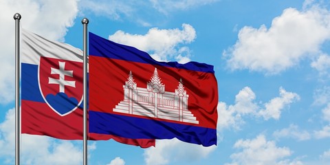 Slovakia and Cambodia flag waving in the wind against white cloudy blue sky together. Diplomacy concept, international relations.