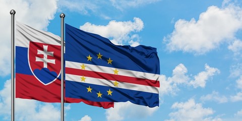 Slovakia and Cape Verde flag waving in the wind against white cloudy blue sky together. Diplomacy concept, international relations.