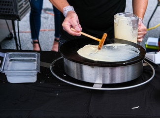 Preparing Crepes at a Night Market