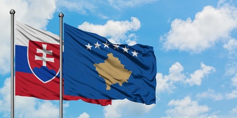 Slovakia and Kosovo flag waving in the wind against white cloudy blue sky together. Diplomacy concept, international relations.