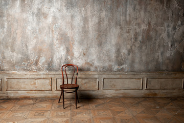 Chair on vintage wall background