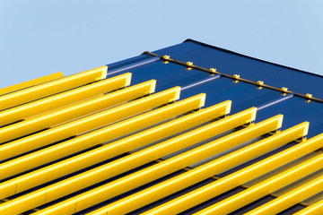 Geometric color elements of the building facade with planes, lines, corners with highlights and...