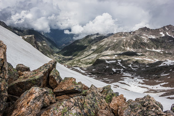 Fototapeta na wymiar high mountains covered with snow and ice, peaks and valleys in the Caucasus