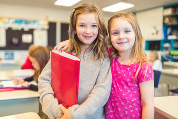 education and school concept little student girl together studying at school