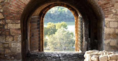 view through one of the gates, made in brick and stone wall, on Kalemegdan fortress, Belgrade, Serbia 