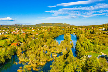 Panoramic view of Mreznica river in autumn from drone, green landscape and waterfalls, Croatia, popular touristic destination