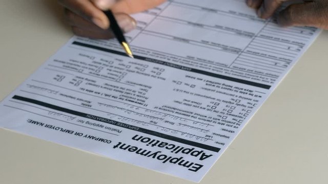 Black migrant filling job application. Work,migration