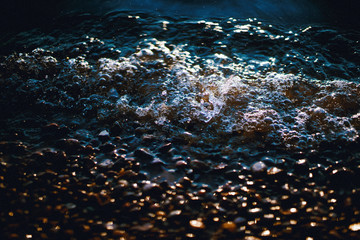 Fototapeta na wymiar rippling waves on the shore