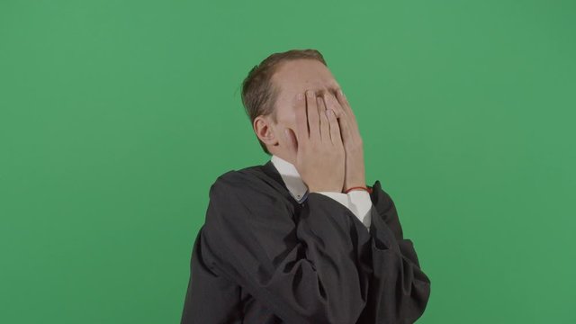 Adult Man Judge Rubbing His Face Frustrated