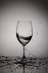 wineglass.  Advertising glass and drinks on a light background. Champagne glass, wine glass with ice cubes, freeze frame.