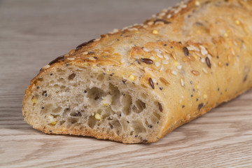 Half French baguette of bread with cereal grains