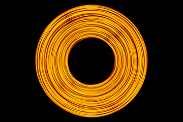 Abstract neon circle lines with empty copy space inside isolated on black background. Colorful led lights long exposure rotation photo.