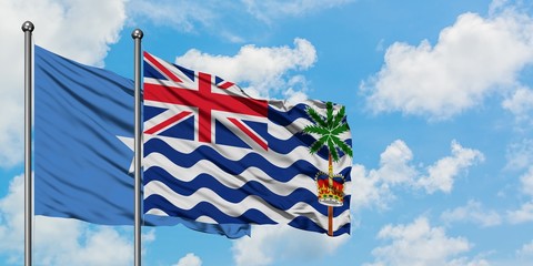 Somalia and British Indian Ocean Territory flag waving in the wind against white cloudy blue sky together. Diplomacy concept, international relations.