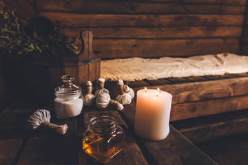 Salt bags for massage, tub, honey and candle in the bath.