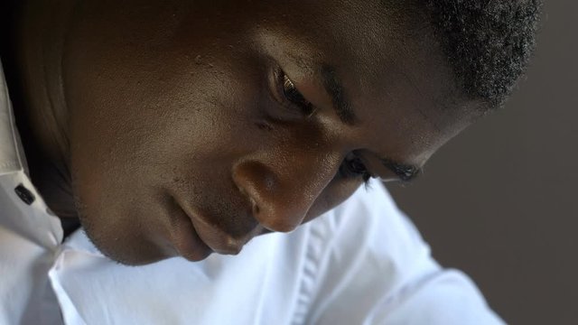 Young african man filling immigration application form.Migration,Legality